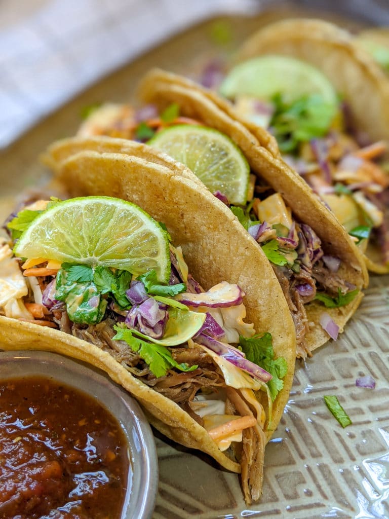 Pork Carnitas tacos with creamy slaw and salsa