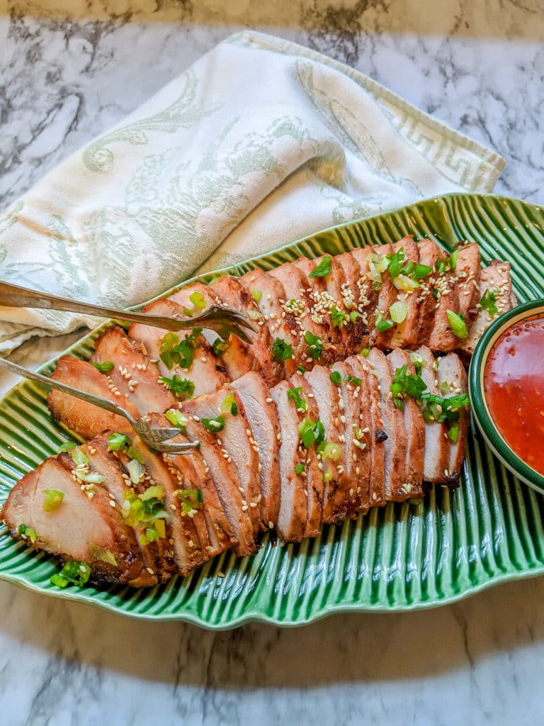 Chinese Bbq Pork On a platter with sweet chili dipping sauce