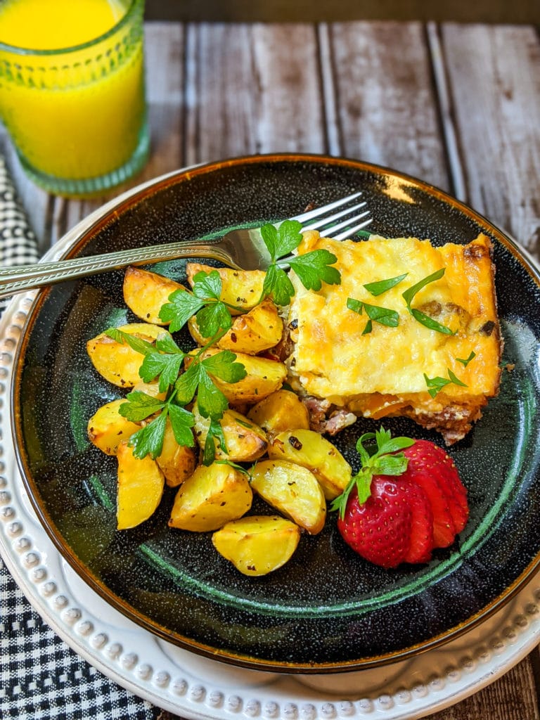 Quiche and potatoes on a plate
