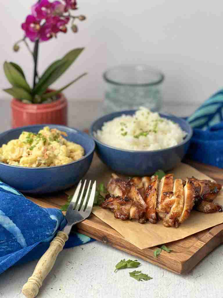 Hawaiian plate lunch on cutting board with fork