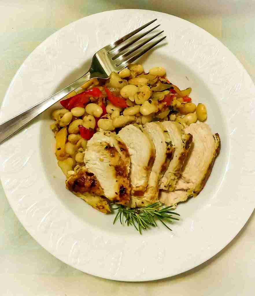 Great northern bean salad in a white bowl