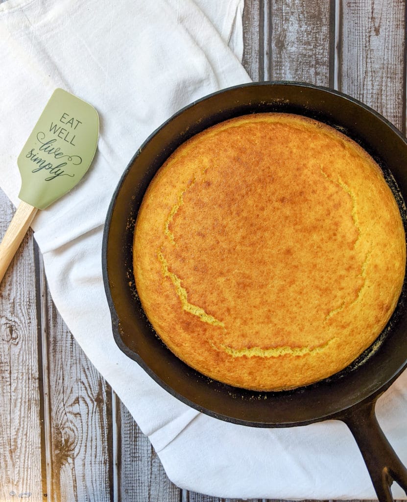 Mom's Cornbread is a savory and delicious cornbread baked and served up in a cast iron skillet, creating a crispy outer crust. Mom's Cornbread