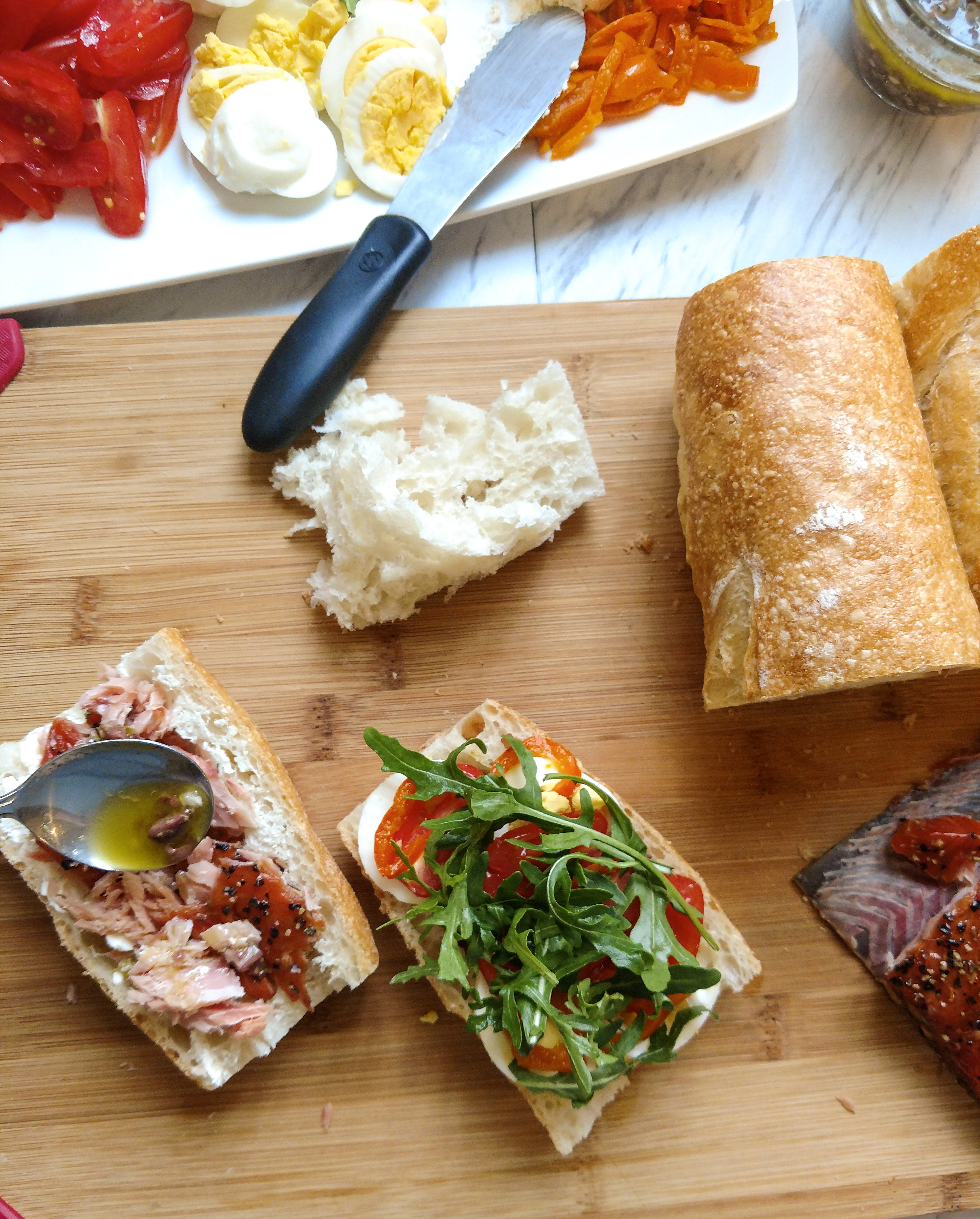 Final steps of the Pan Bagnat sandwich