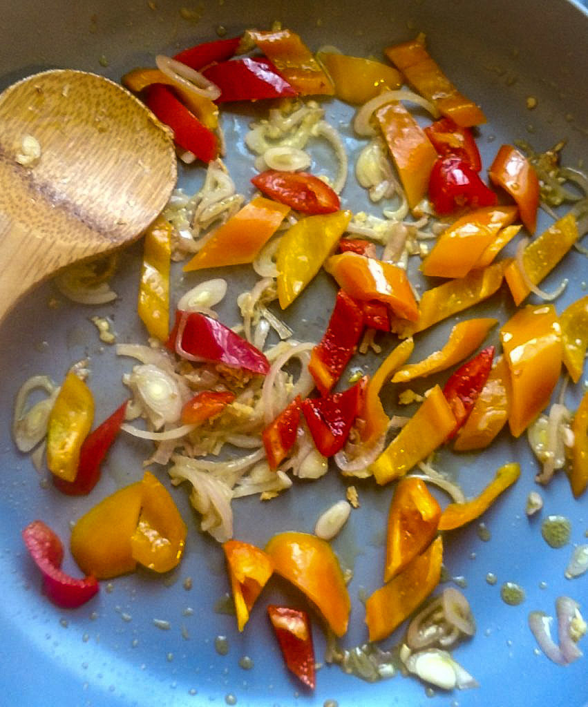 Onion, garlic and peppers in a pan