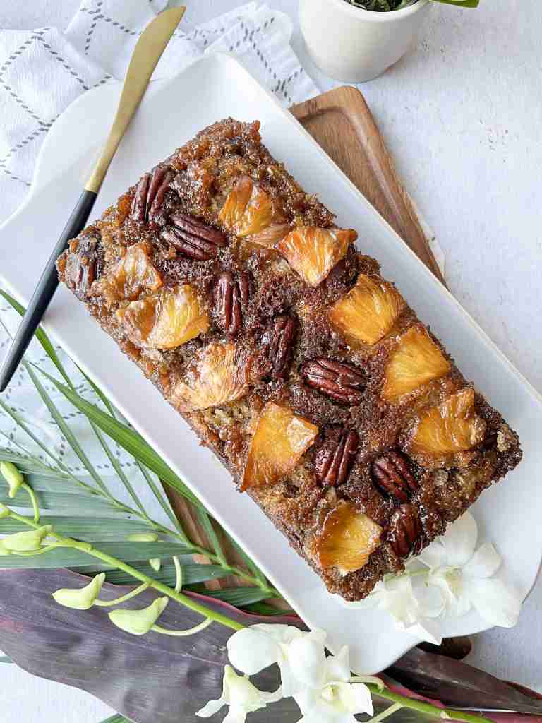 Pineapple upside down banana bread on a white platter
