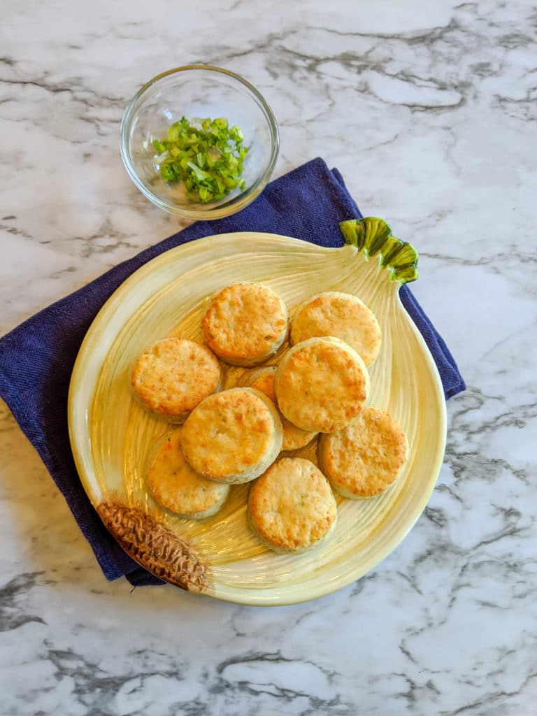 gruyere and scallion biscuits on a plate