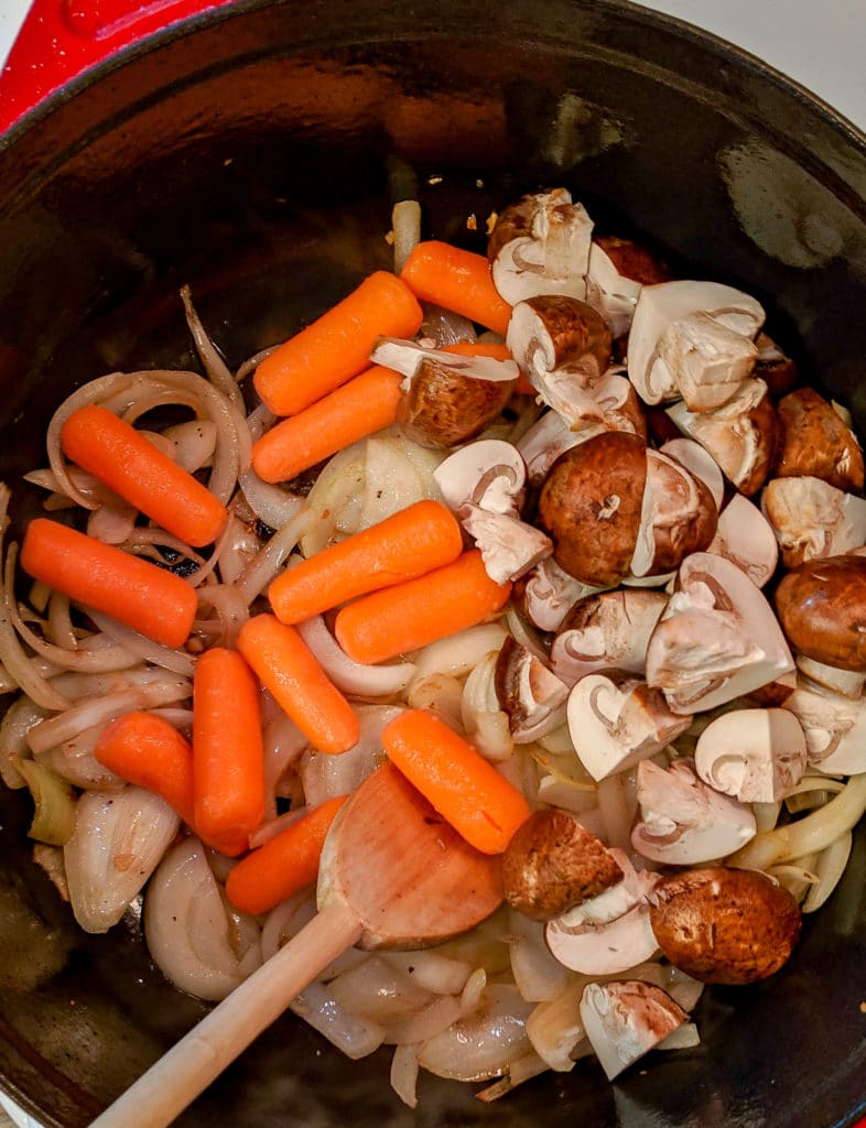 A pan filled with meat and vegetables