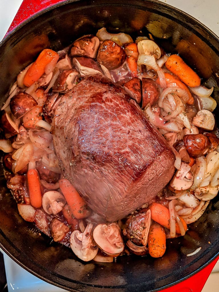 A pan filled with meat and vegetables