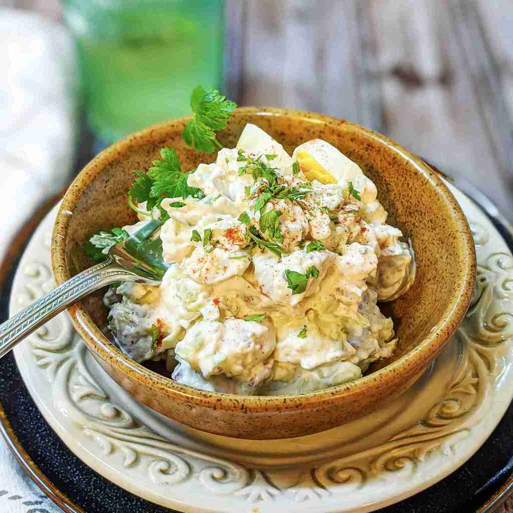 Potato salad in ceramic bowl
