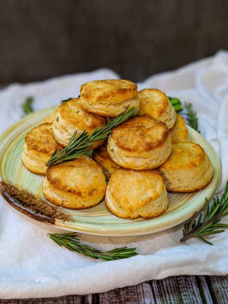 Little rosemary asiago two bite biscuits on an onion shaped plate