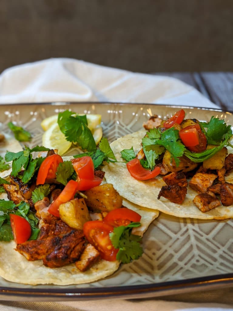 A plate of tacos on a table
