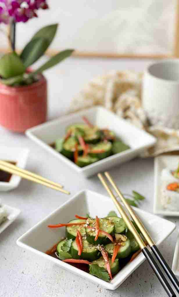 Asian Cucumber Salad in square white bowls