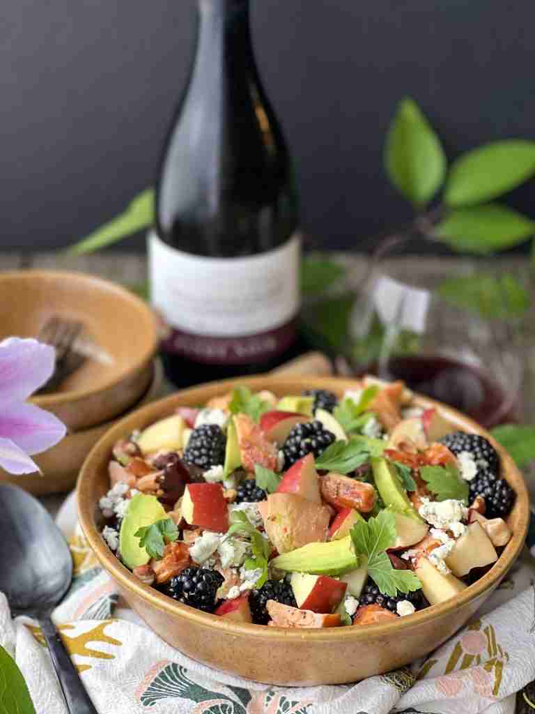 Smoked salmon salad with wine and serving bowls