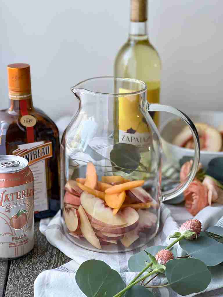 Pictcher with fruit on a table